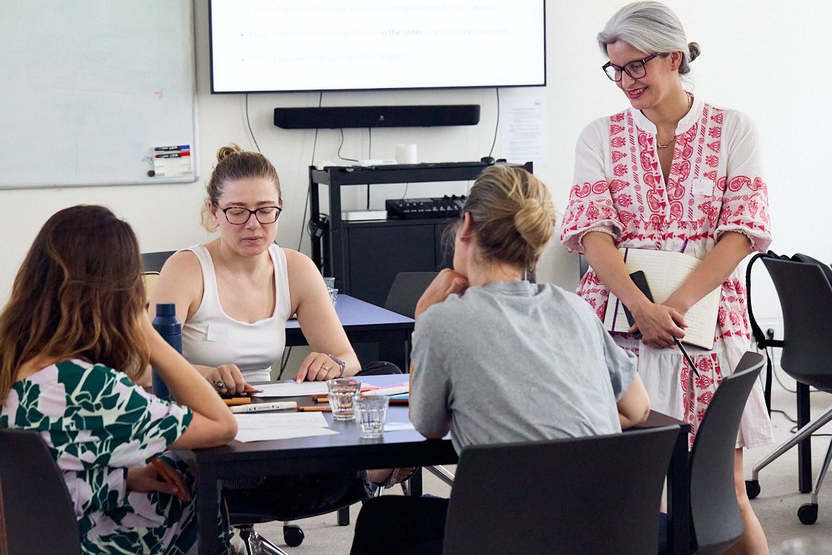 Adis leading a Designing Your Life workshop with a small group
